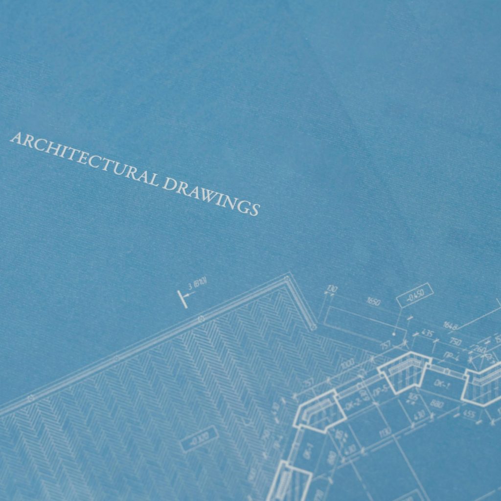 Close-up view of architectural blueprint with technical drawings.